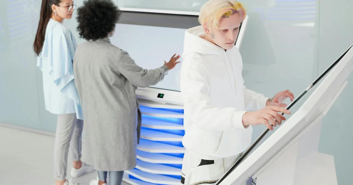 Students engaging with advanced artificial intelligence in a modern, teacher-less learning environment.