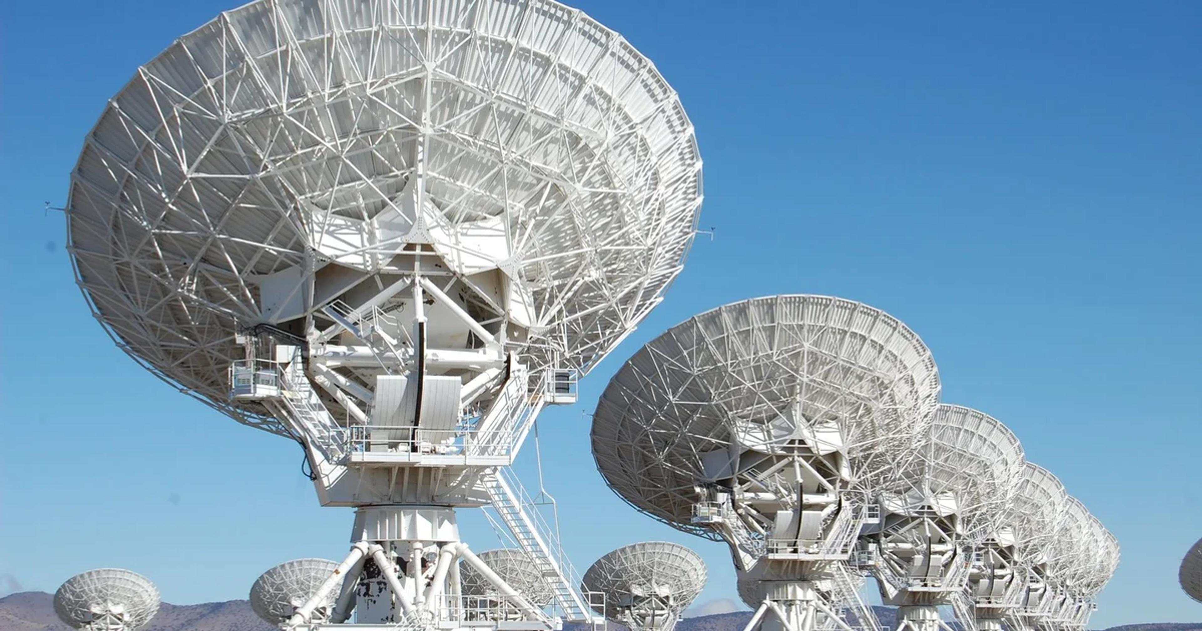 AI-powered radio telescope systems analyzing extraterrestrial signals in a high-tech control room.