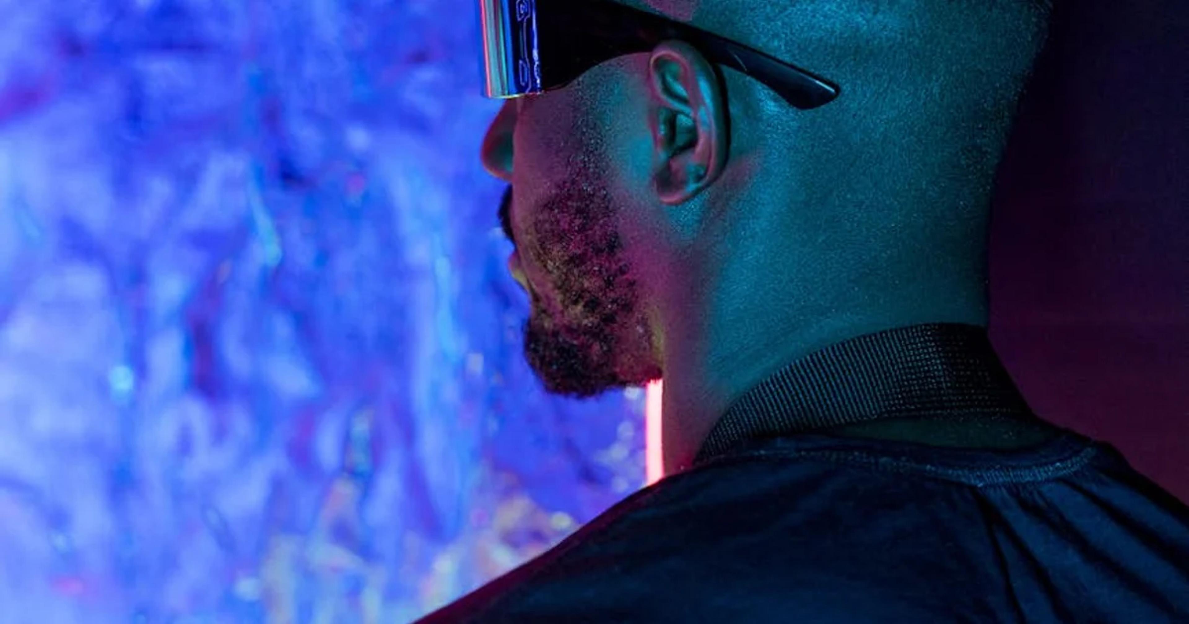 Futuristic financial analyst reviewing AI investment trends and market projections on a holographic interface.