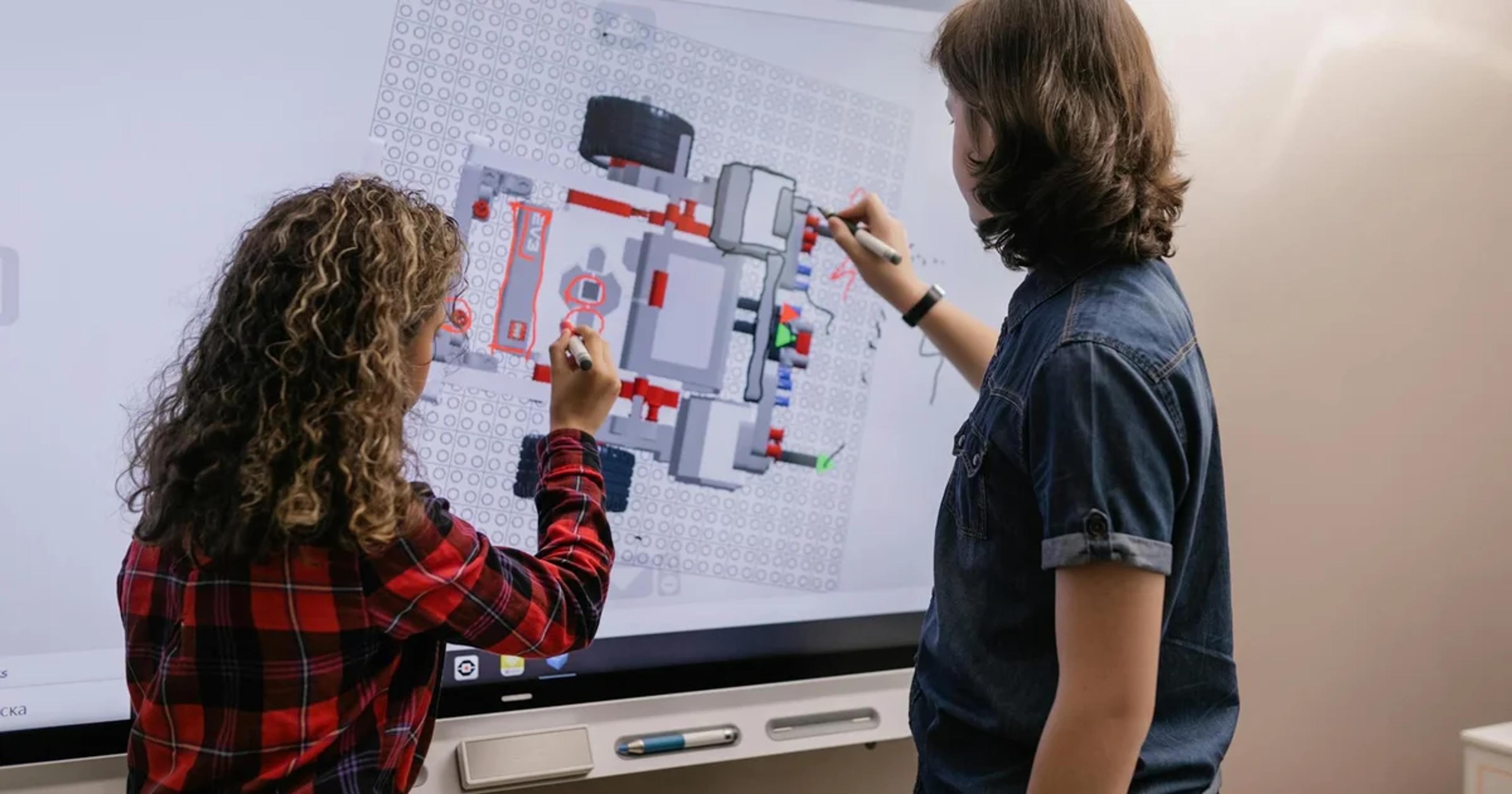 Students and teachers interact with advanced AI tools and interfaces in an innovative classroom setting.