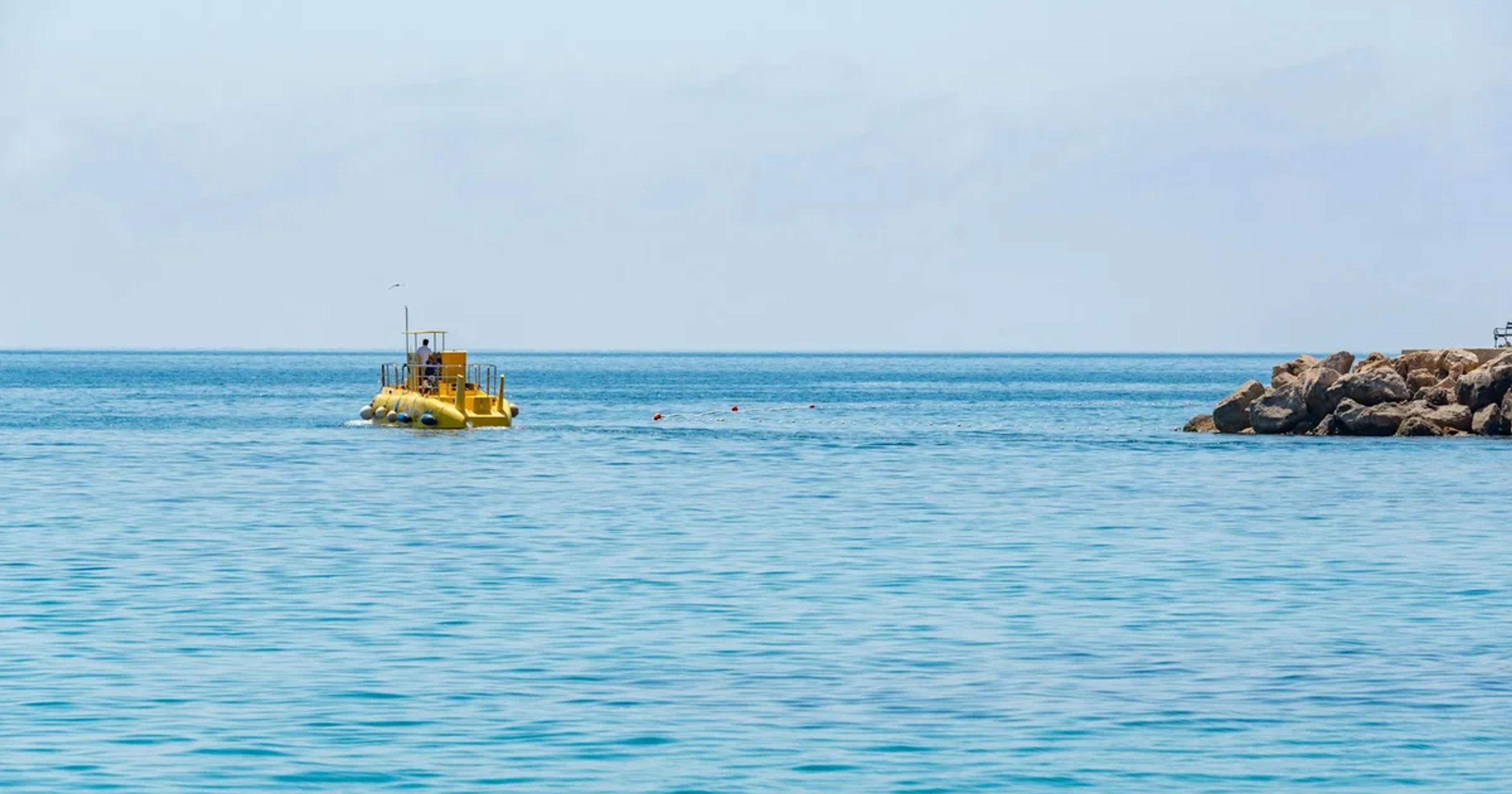 An autonomous AI-powered underwater drone scanning a bioluminescent ocean floor with high-tech sensors.