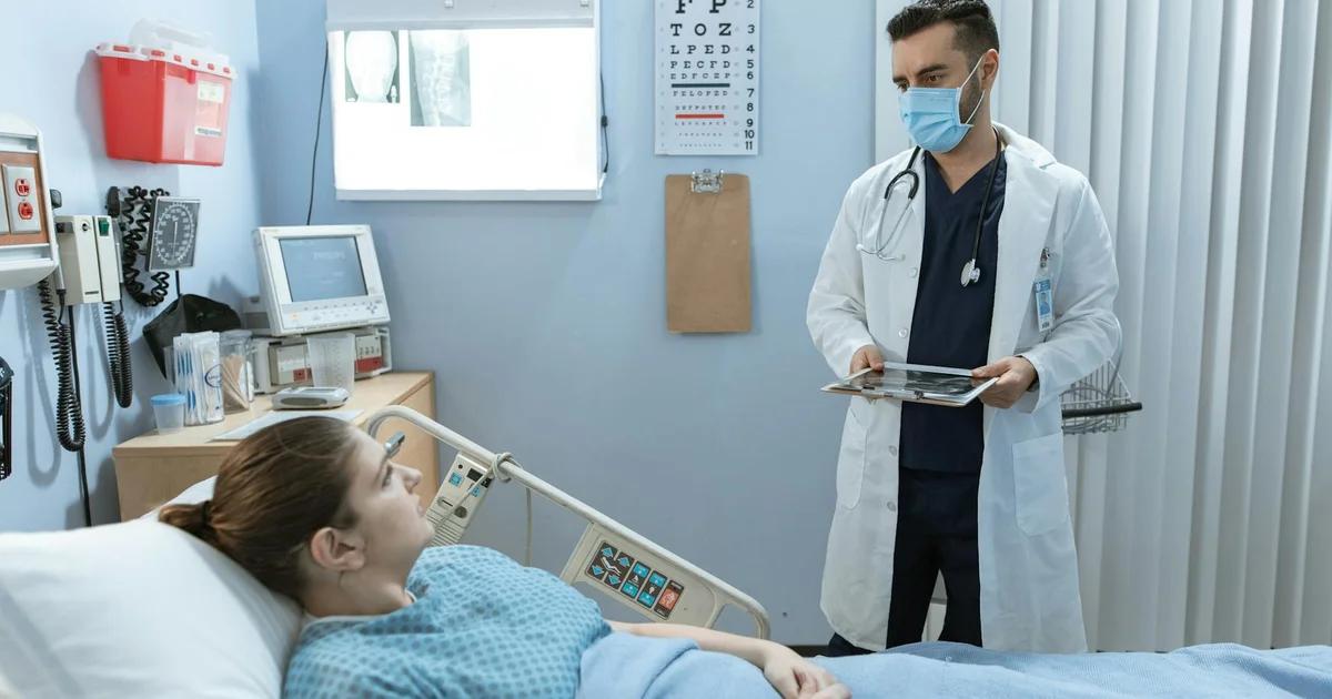 A doctor and an AI interface collaboratively reviewing medical diagnostic data, highlighting AI's supportive yet constrained role.