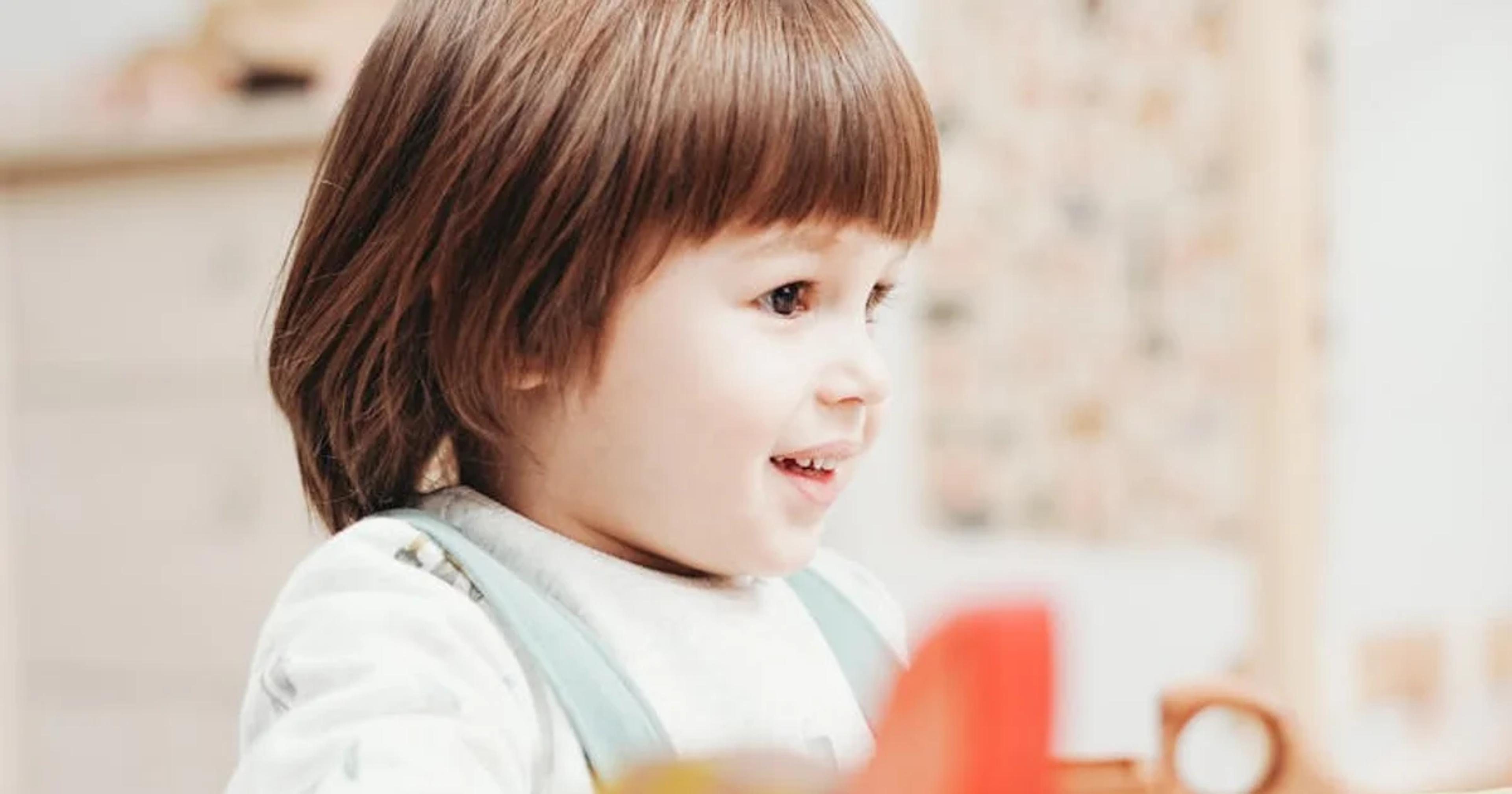 Child safely using an AI chatbot with parental oversight and protective digital measures.