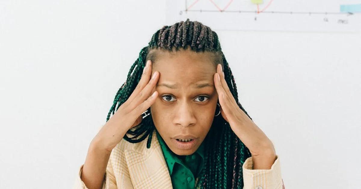 A person surrounded by abstract, glowing data visualizations and futuristic AI interfaces, conveying cognitive overload.