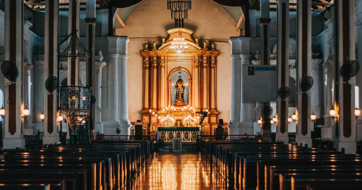 A stylized digital interface interacting with religious symbols in a modern sanctuary.