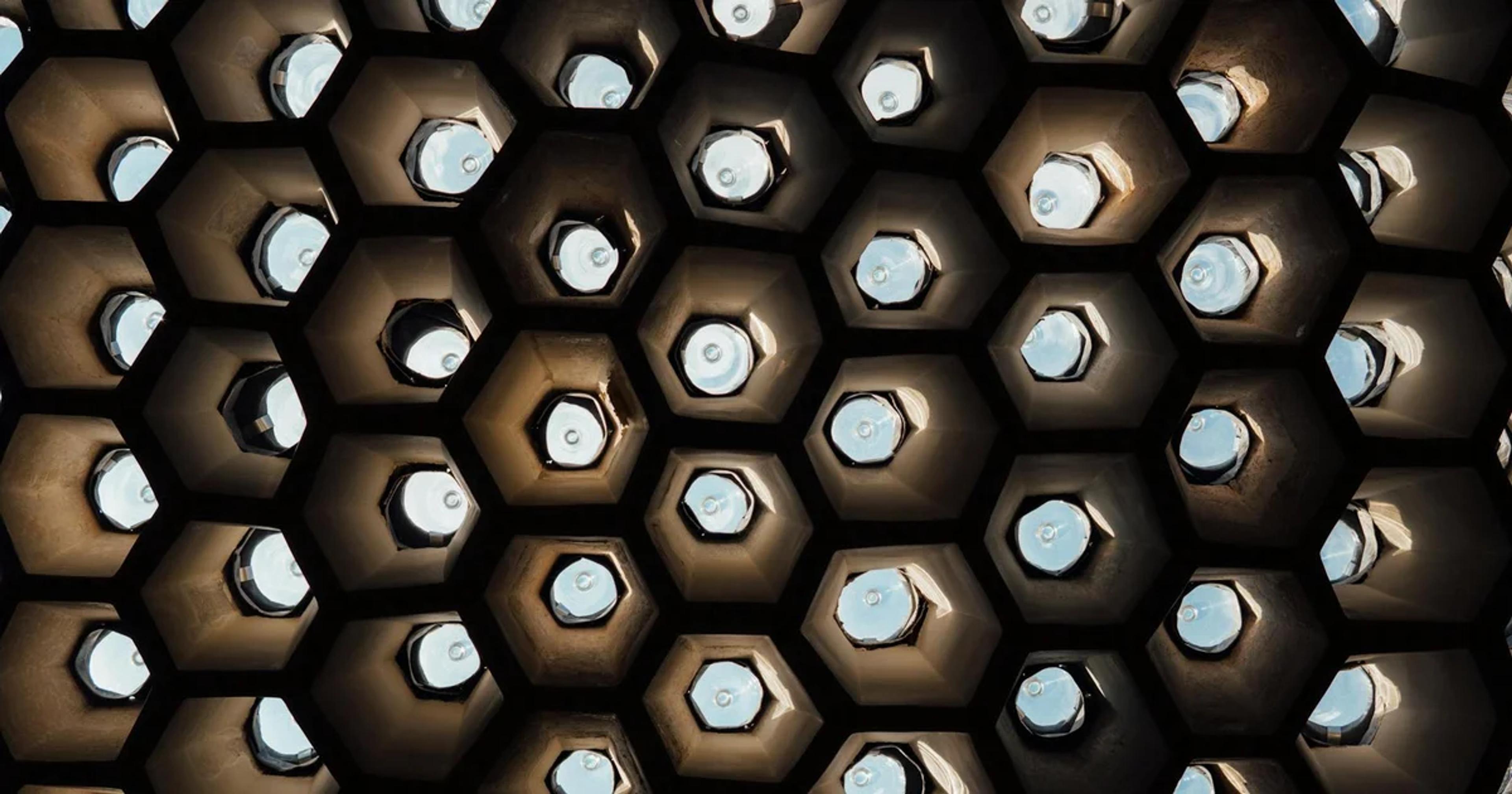 Advanced smart beehive with integrated AI sensors tracking environmental data in a green landscape.