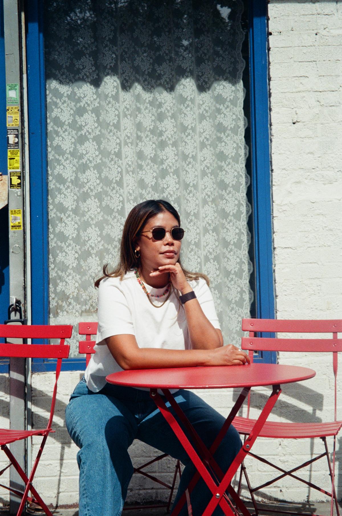 Pias sitting outside.