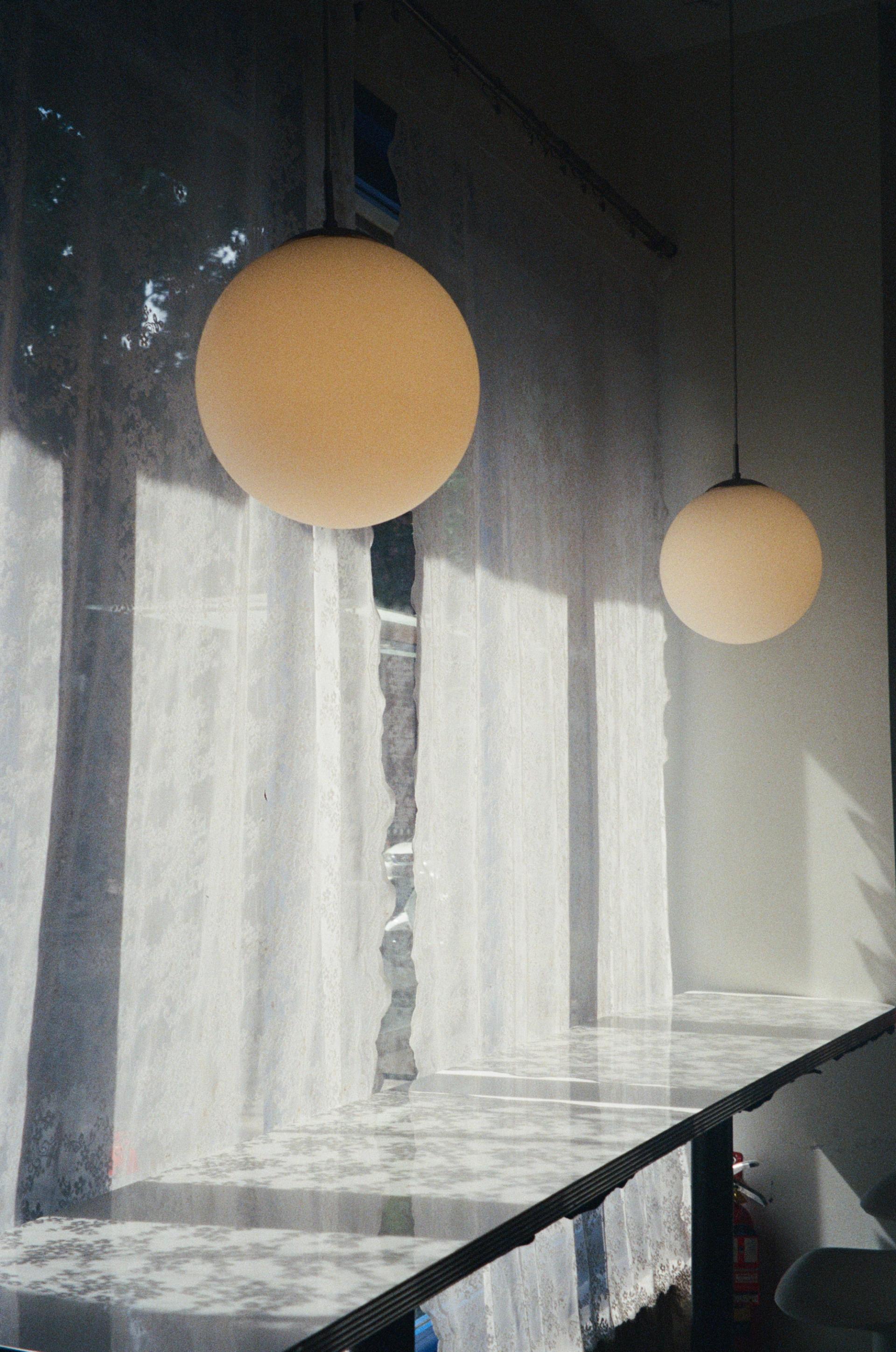 Beautiful light and curtains inside Brooklyn restaurant.