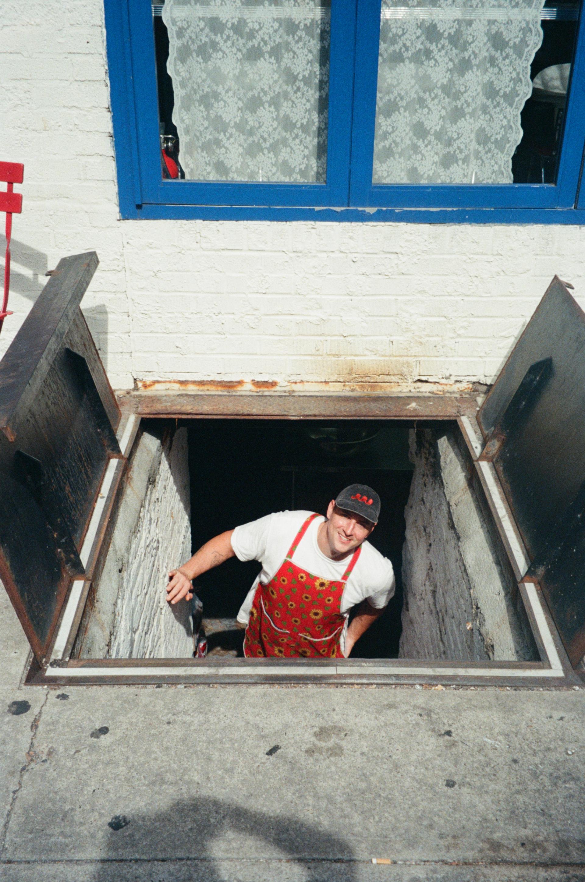 Trevor peeking out the restaurant cellar.