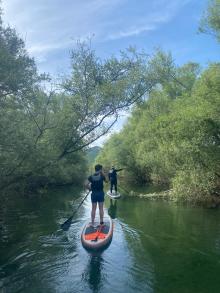 Paddleboard through wild, narrow channels