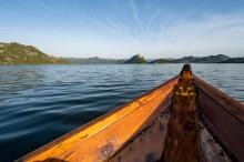 Glide across Lake Skadar in a traditional wooden boat
