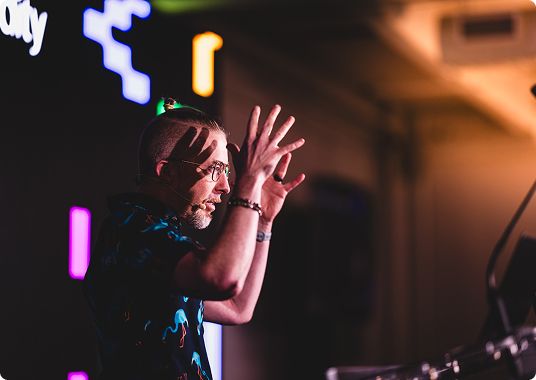 Speaker on stage at DevCon New York 2025