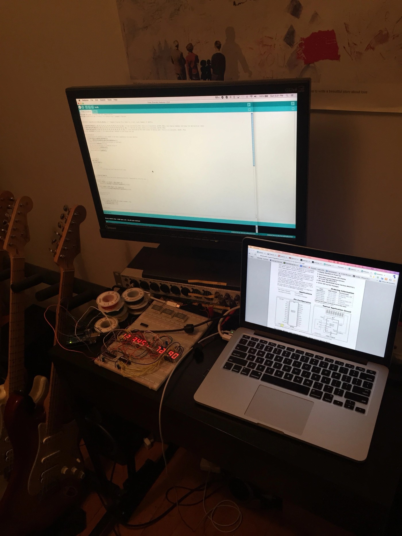 a laptop is open on a desk next to a monitor