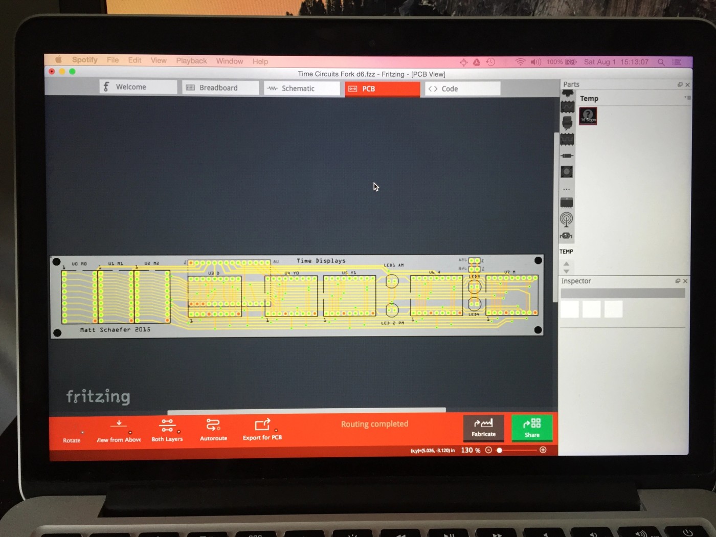 a laptop computer is open to a program called fritzing .