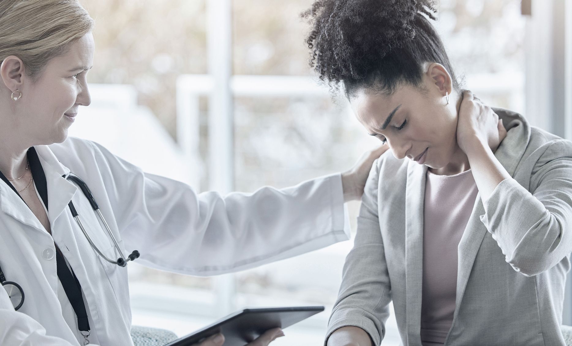 Doctor Comforting Patient With Neck Pain | Person injury AOP