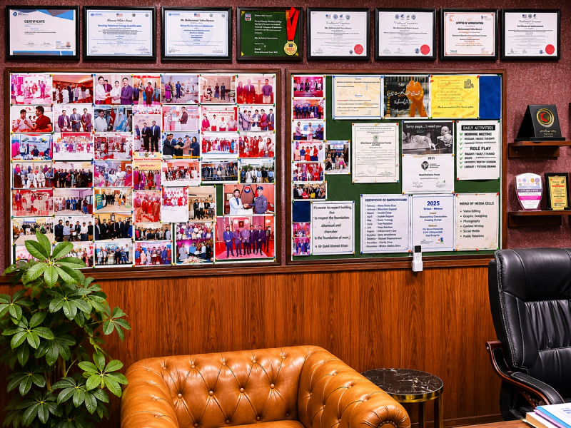 IRADA achievement board displaying certificates and photographs