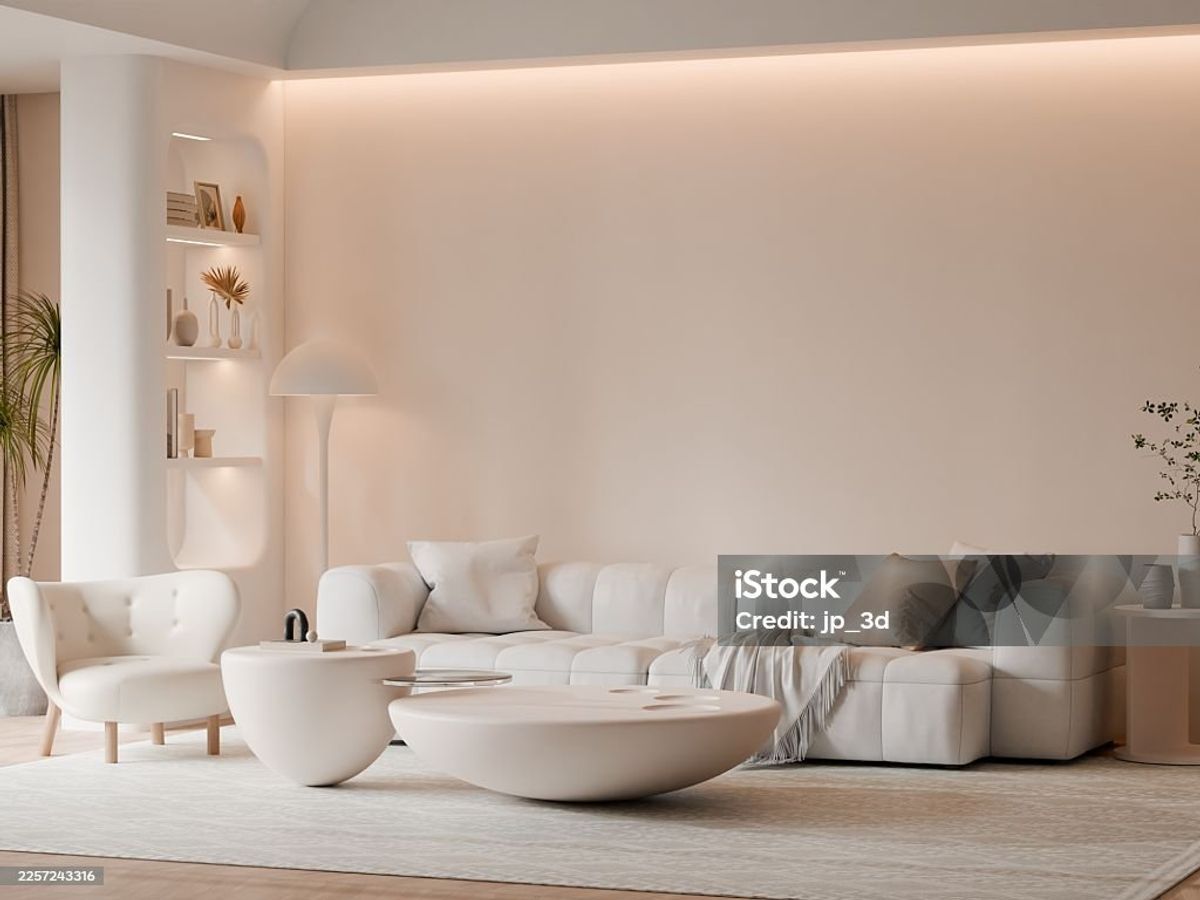 Warm neutral living room with a cream sofa, natural wood accents, and soft lighting