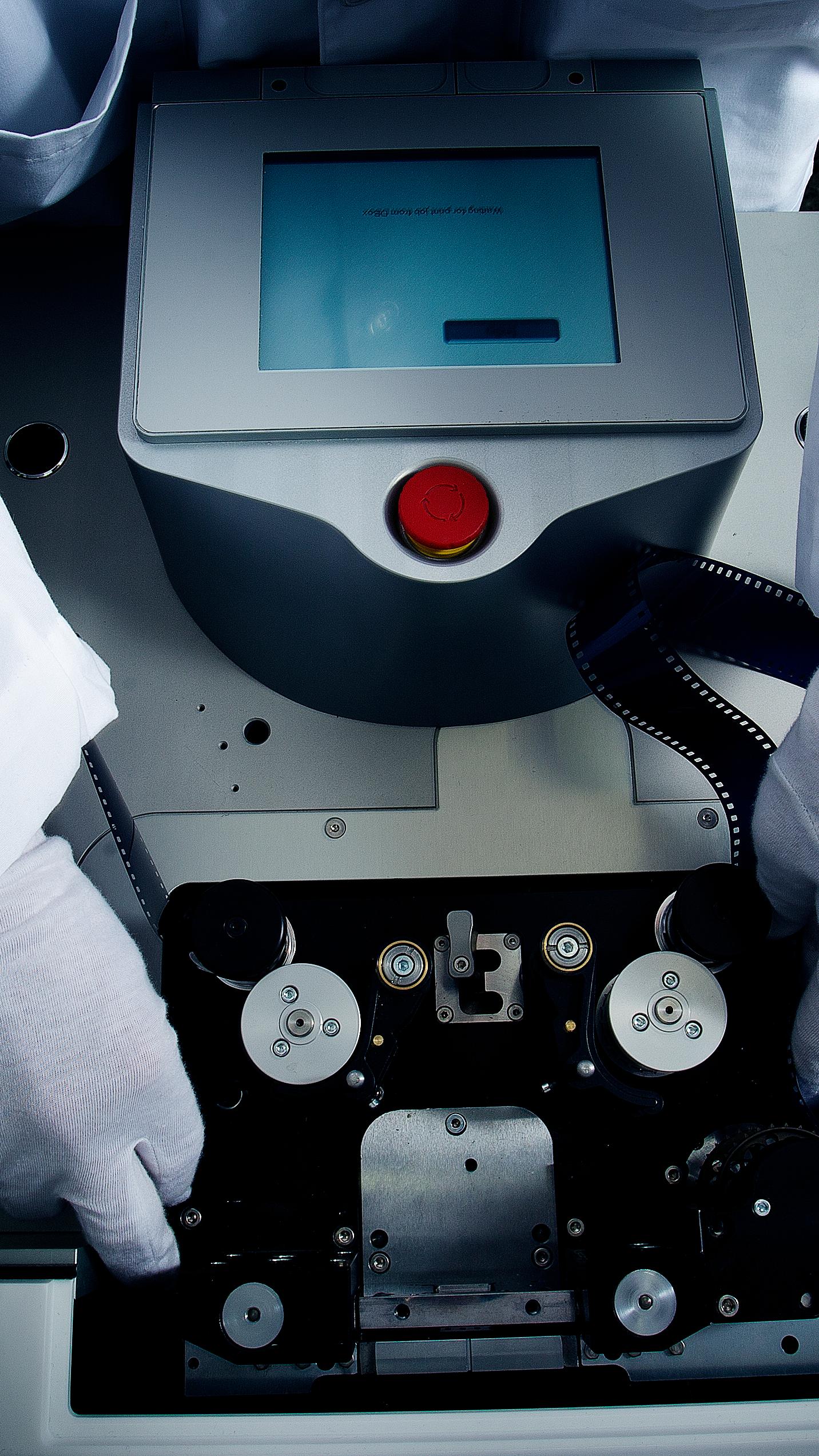 A man handling a film strip
