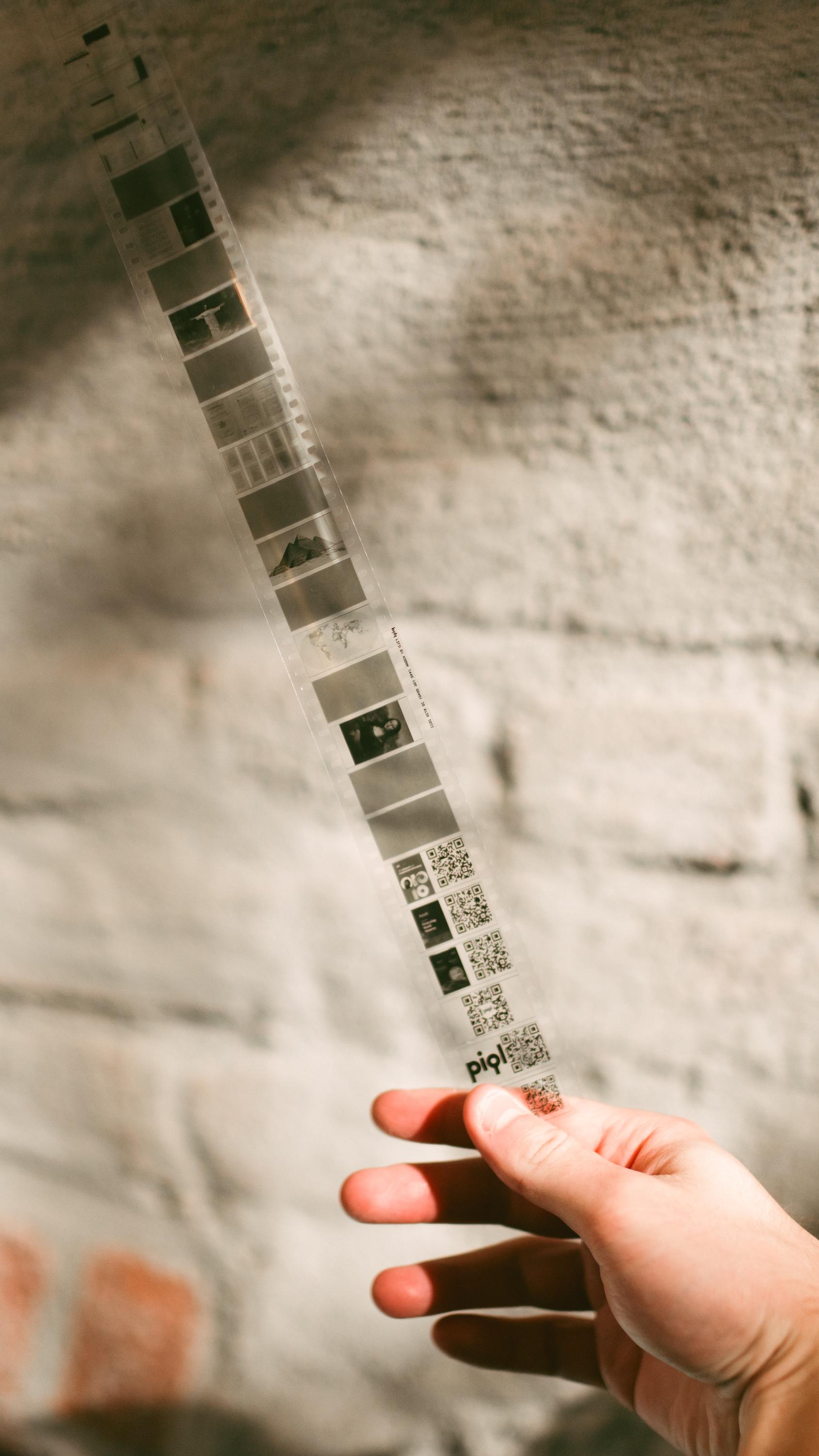 A man holding a 35mm film strip.