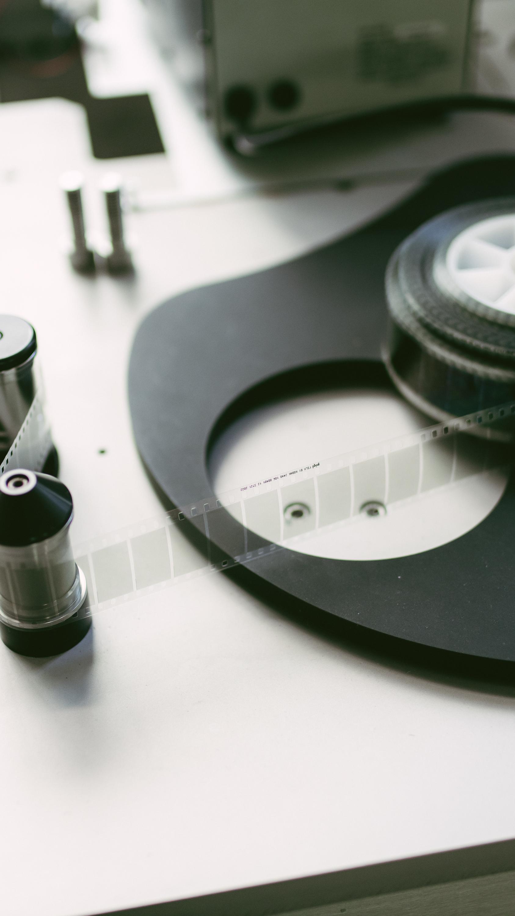 A man holding a 35mm piqlFilm strip.