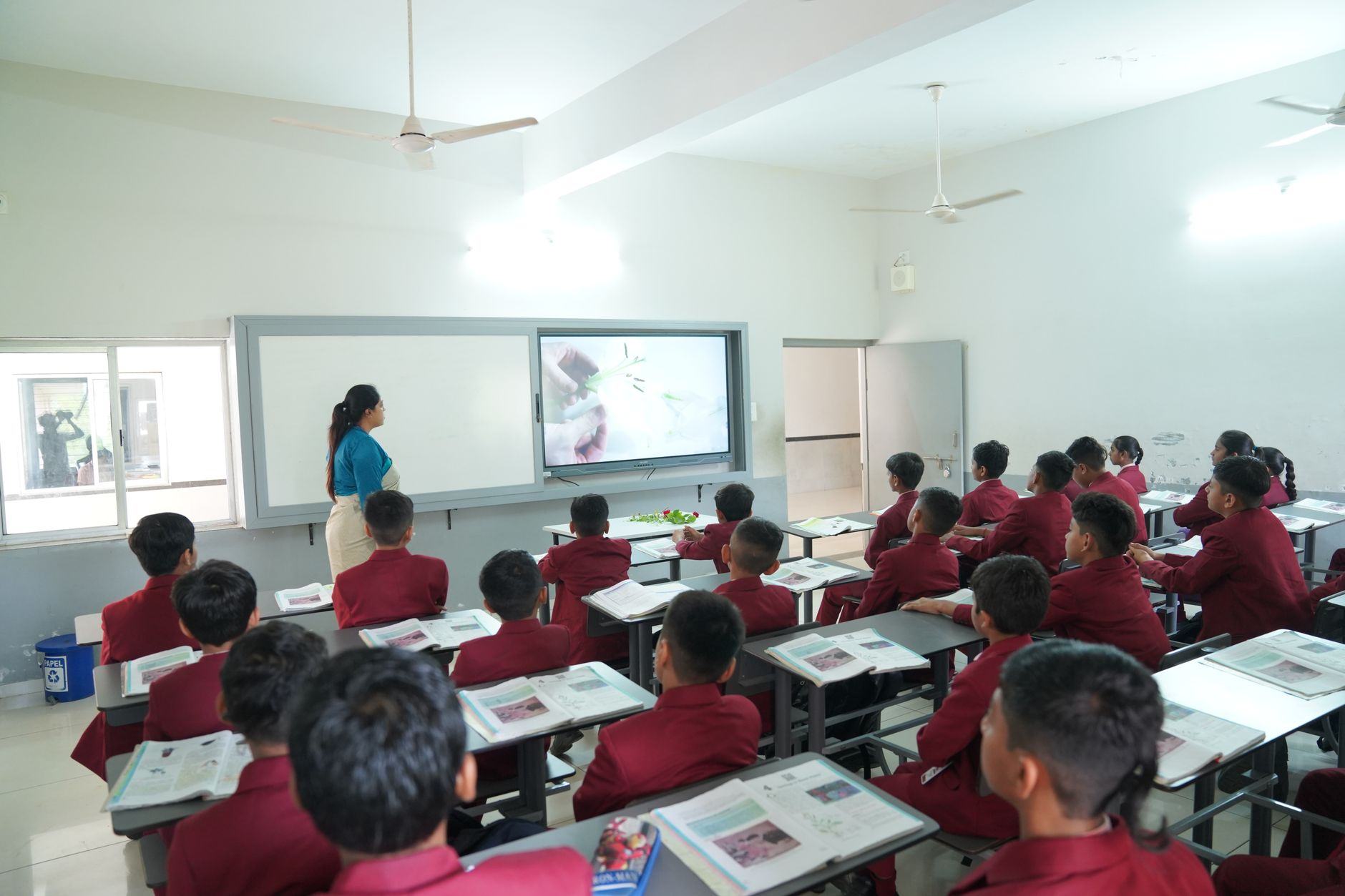 A lecturer teaching students in a hall — Vadodara education institution, Vadodara · Webzenia SEO case study