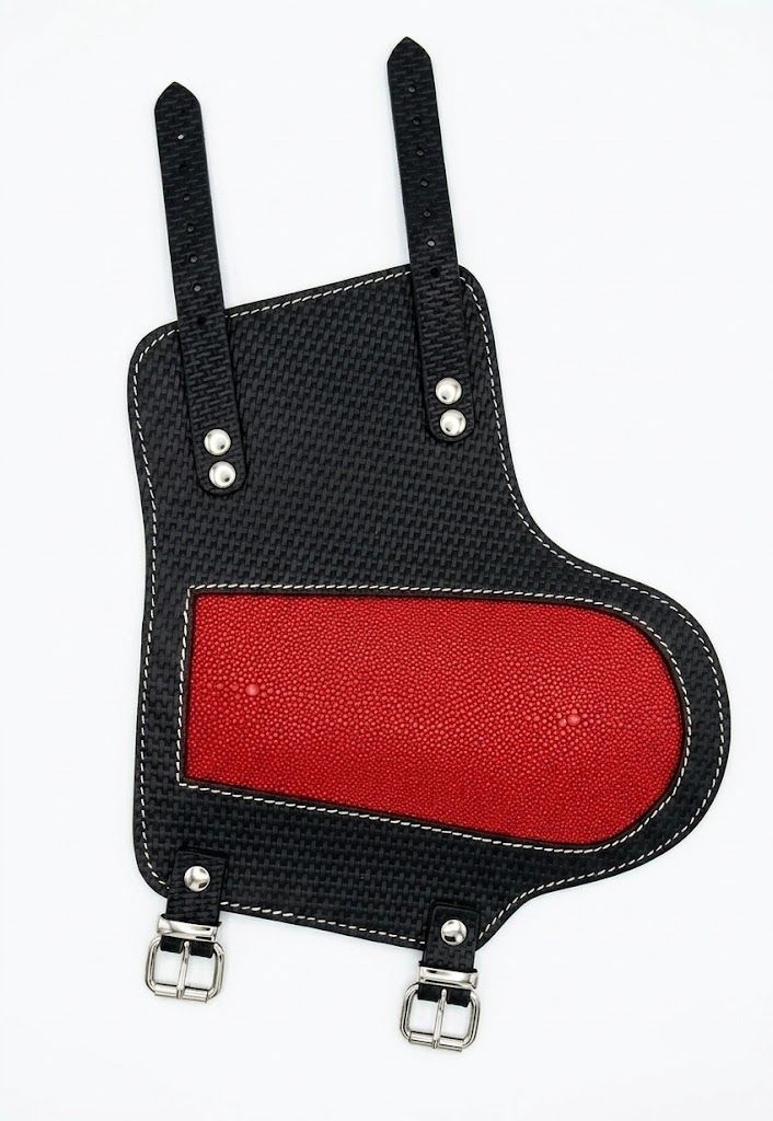 forearm guard in black with a red leather panel, front view, manufactured by Abeeha Leather Industry