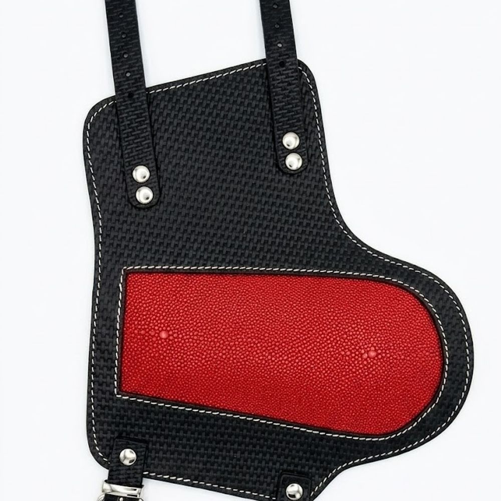 forearm guard in black with a red leather panel, front view, manufactured by Abeeha Leather Industry