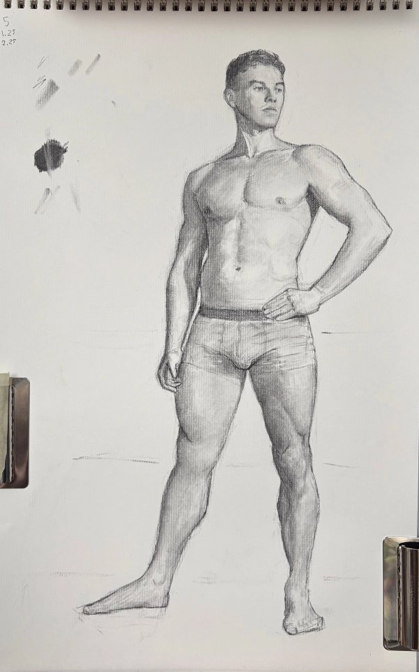 Charcoal figure drawing of a standing male model with a hand on his hip.