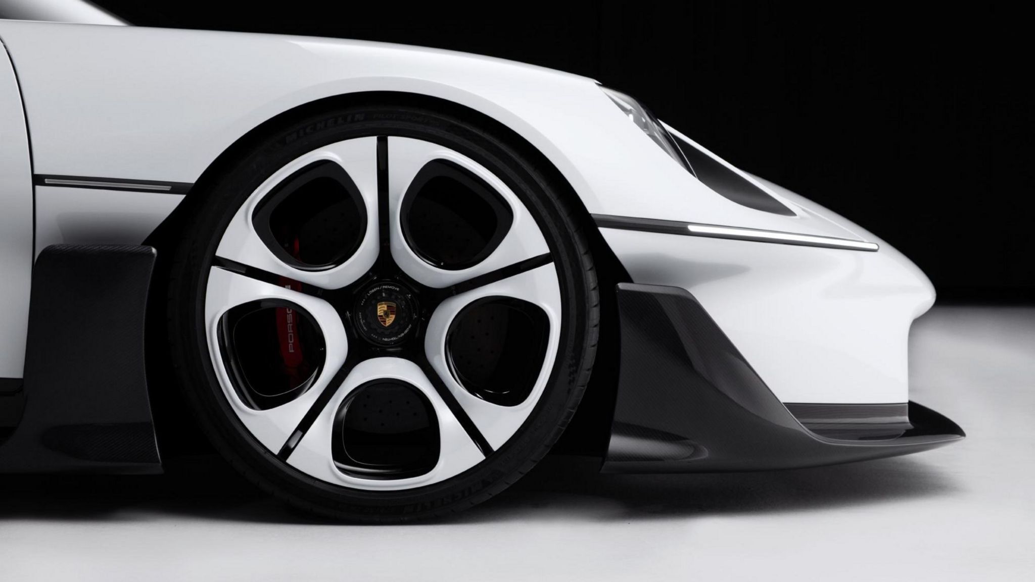 Porsche Mission S concept supercar in white with a black roof, front three quarter view