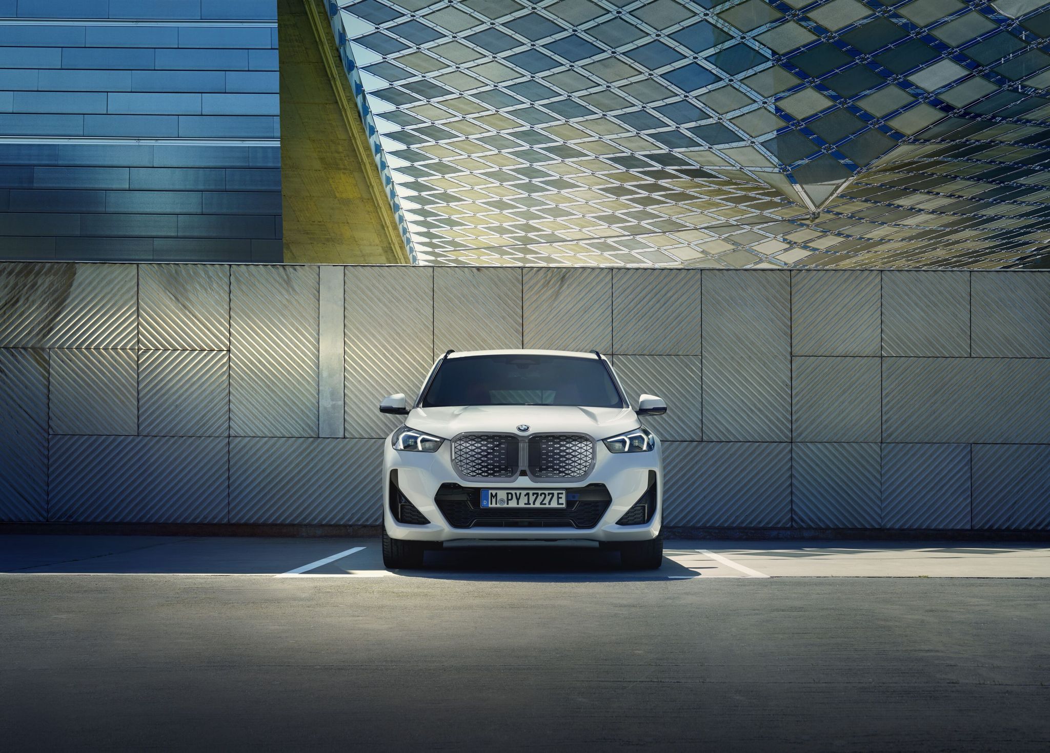 2026 BMW iX1 xDrive30 Sport Collection electric SUV Alpine White exterior