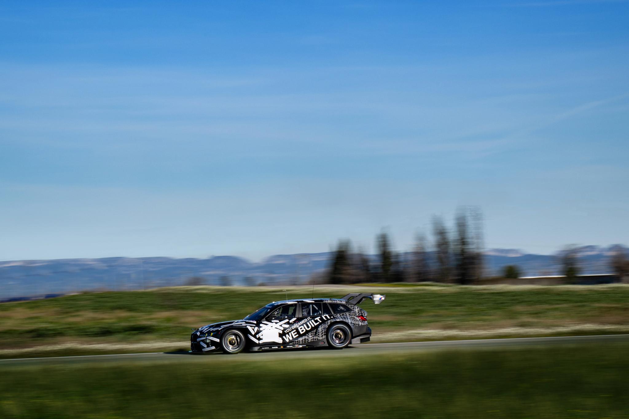 BMW M3 Touring 24H race car on track at the Nürburgring with GT3-spec bodywork and rear wing