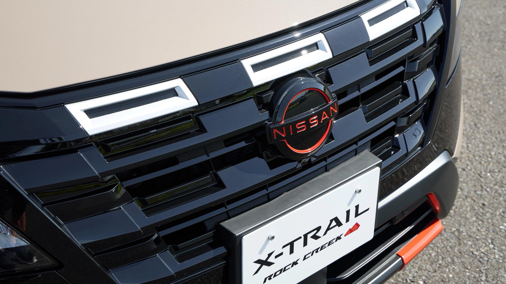 2026 Nissan X-TRAIL Rock Creek in Baja Storm front grille