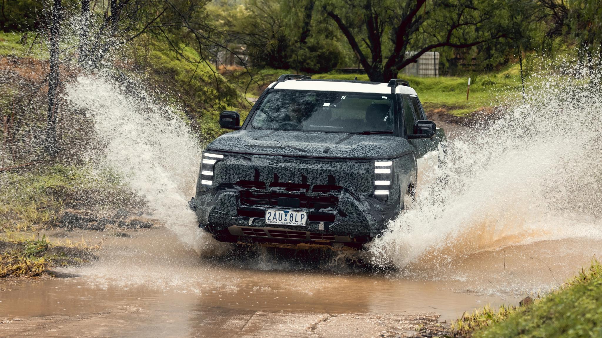 Camouflaged Nissan Navara Pro PHEV prototype dual-cab ute
