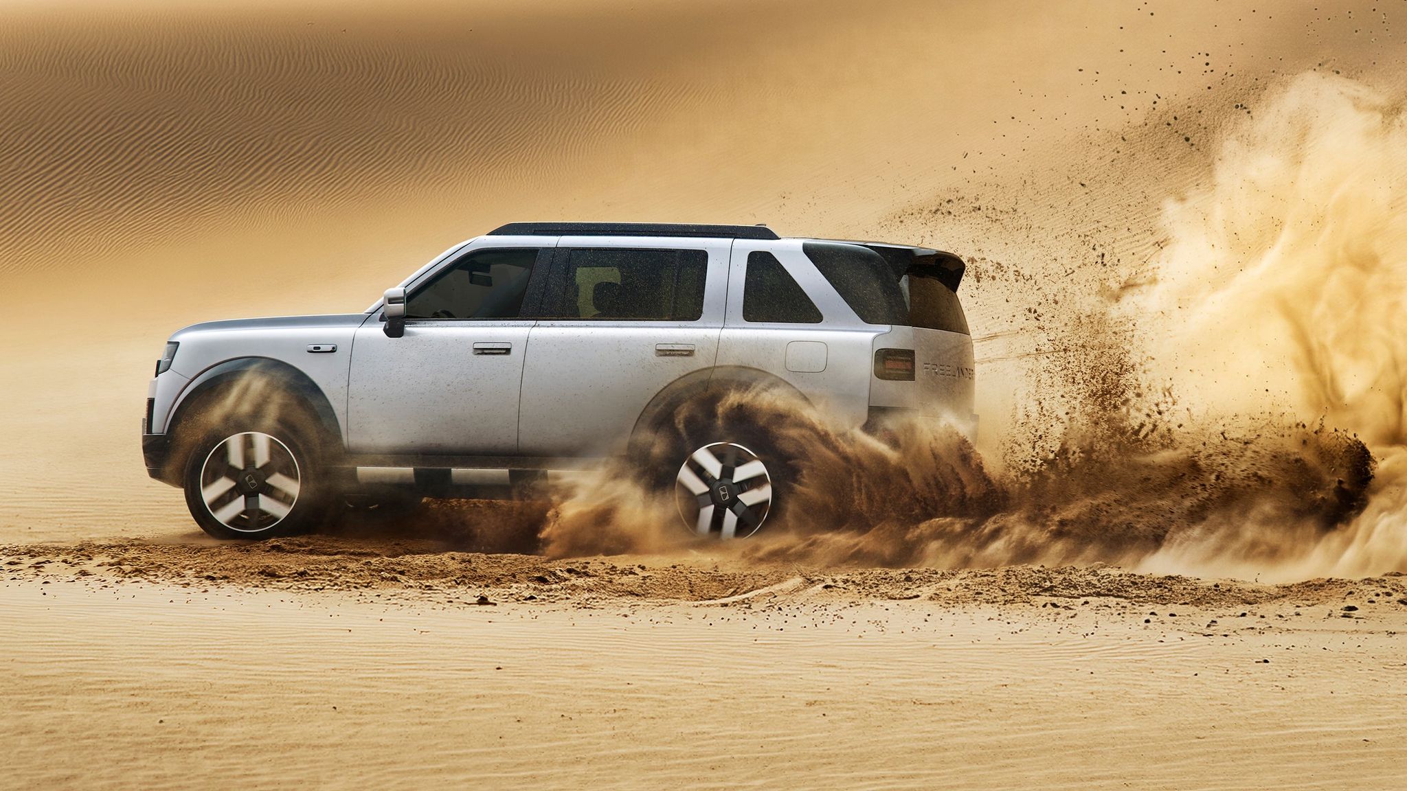 Freelander 8 large SUV driving in dirt