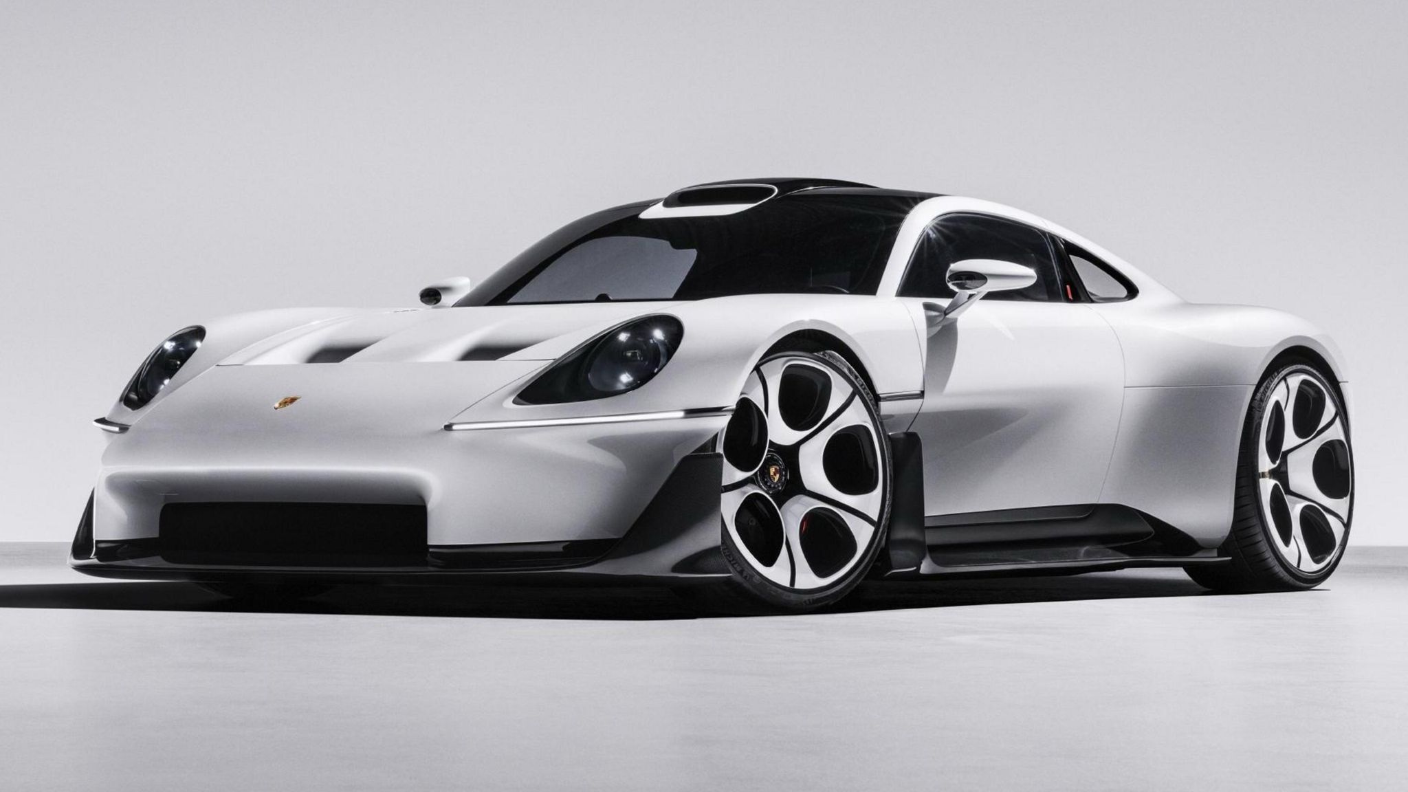 Porsche Mission S concept supercar in white with a black roof, front three quarter view