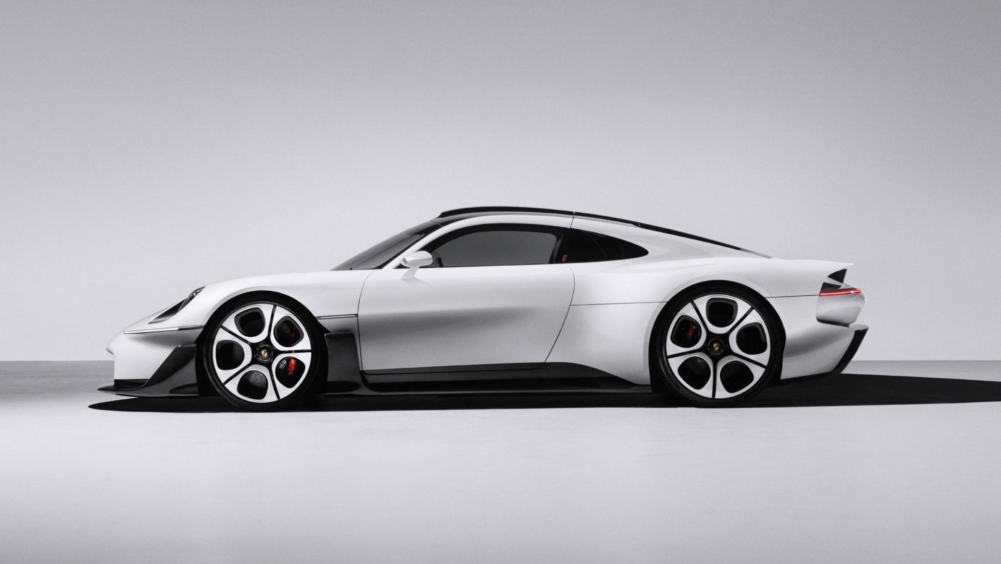 Porsche Mission S concept supercar in white with a black roof, front three quarter view