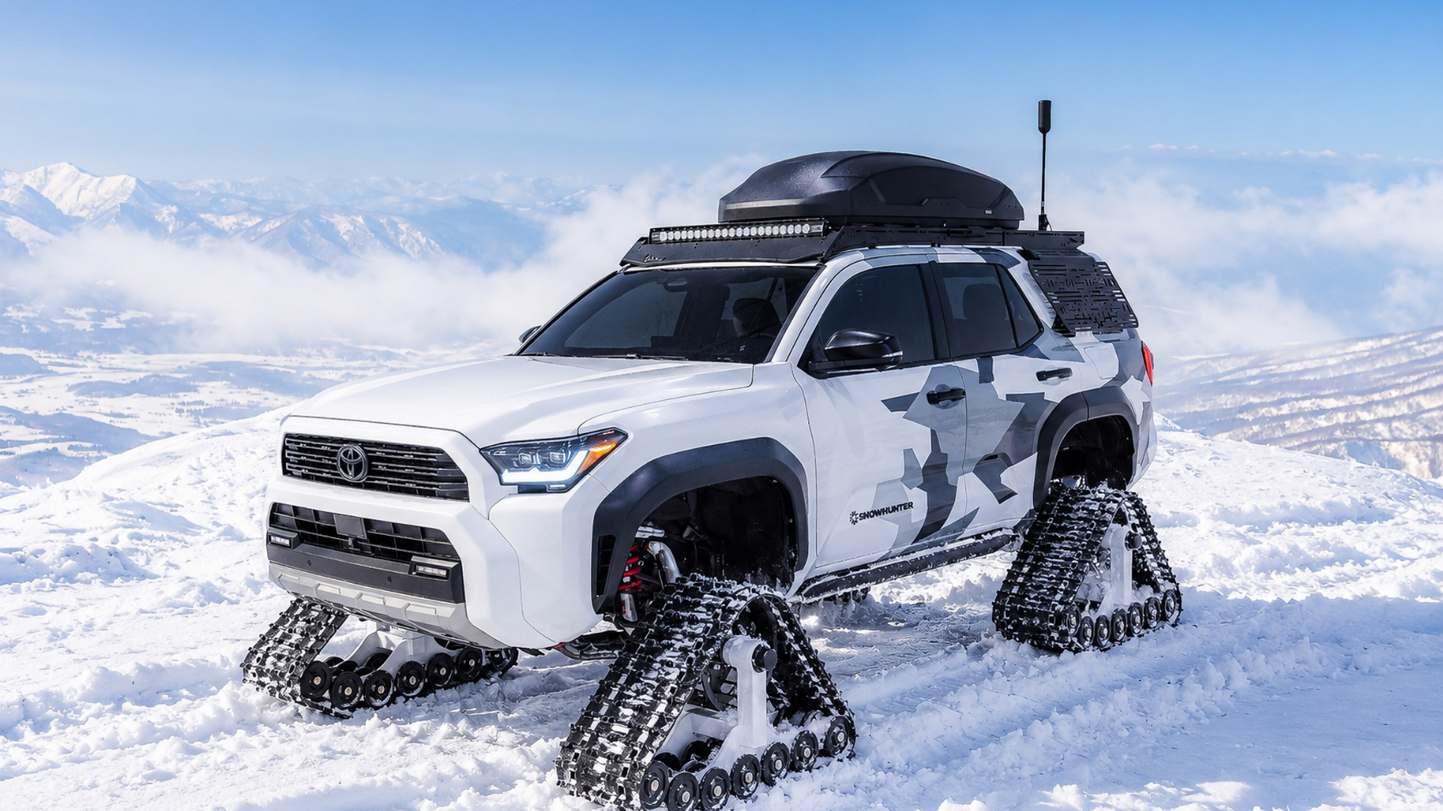 Toyota Snowhunter concept on white snow tracks with a roof-mounted ski rack