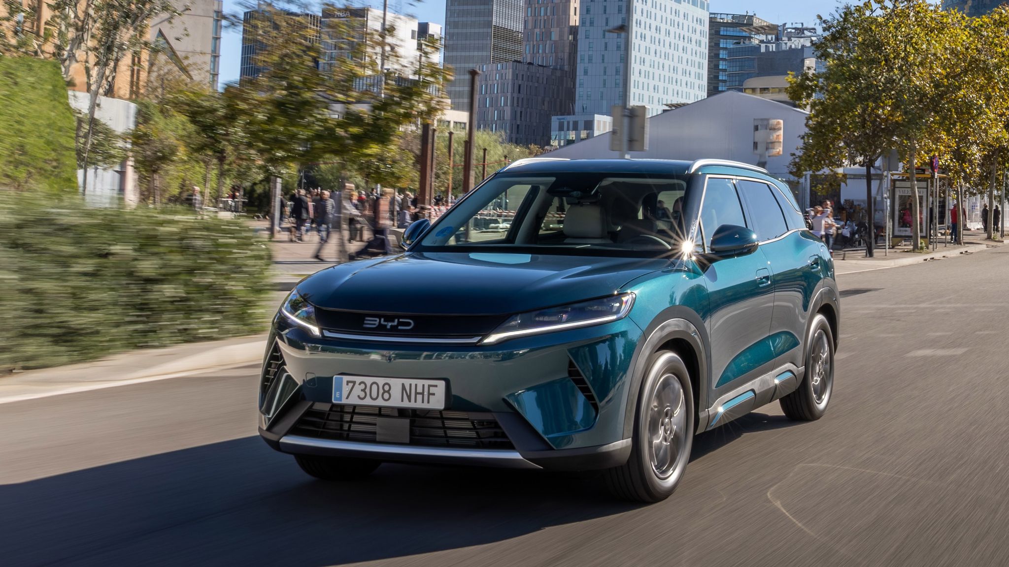 BYD Atto 2 DM-i plug-in hybrid SUV in Midnight Blue driving on road, front three-quarter view