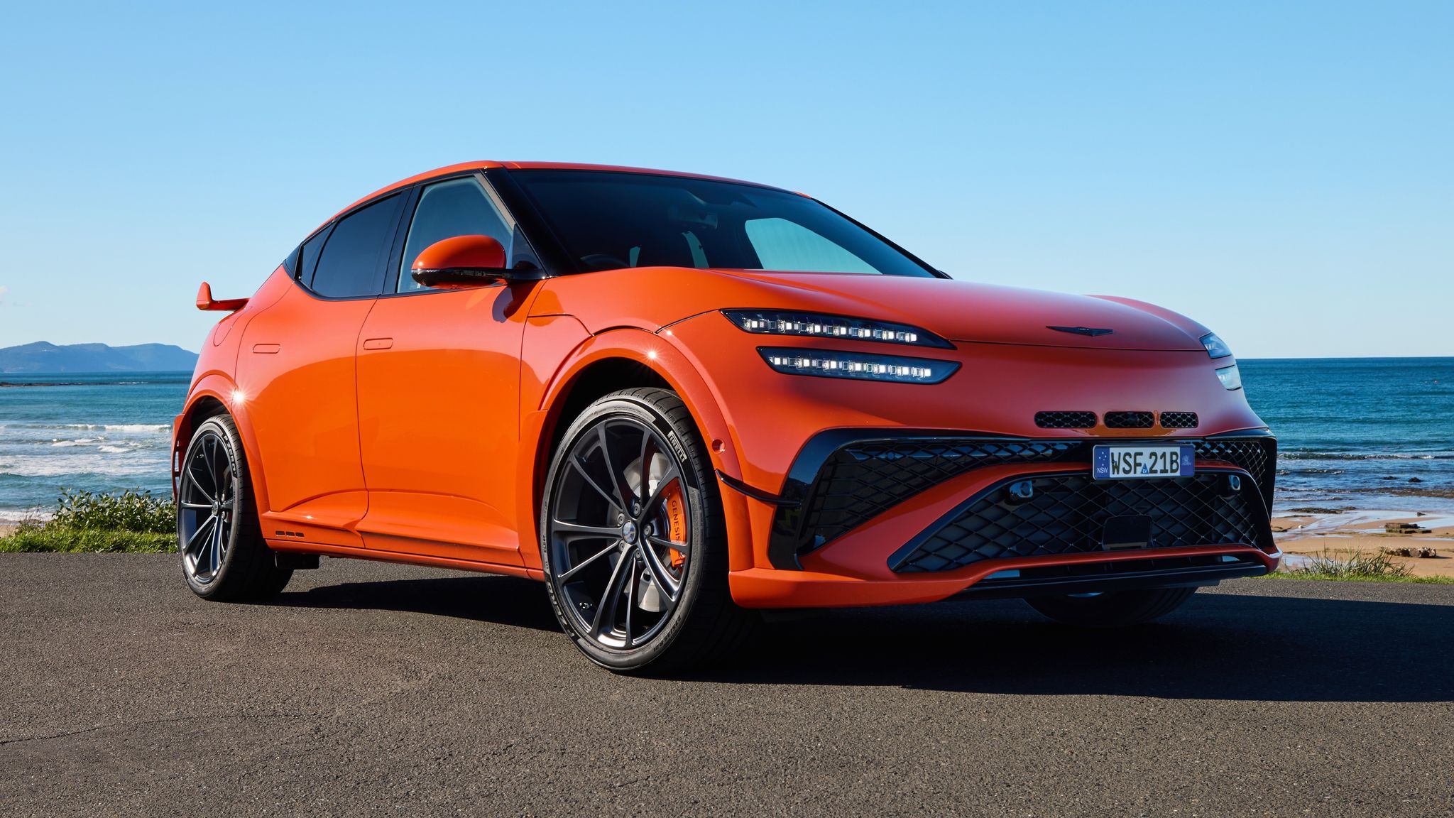 2026 Genesis GV60 Magma performance electric SUV front three quarter