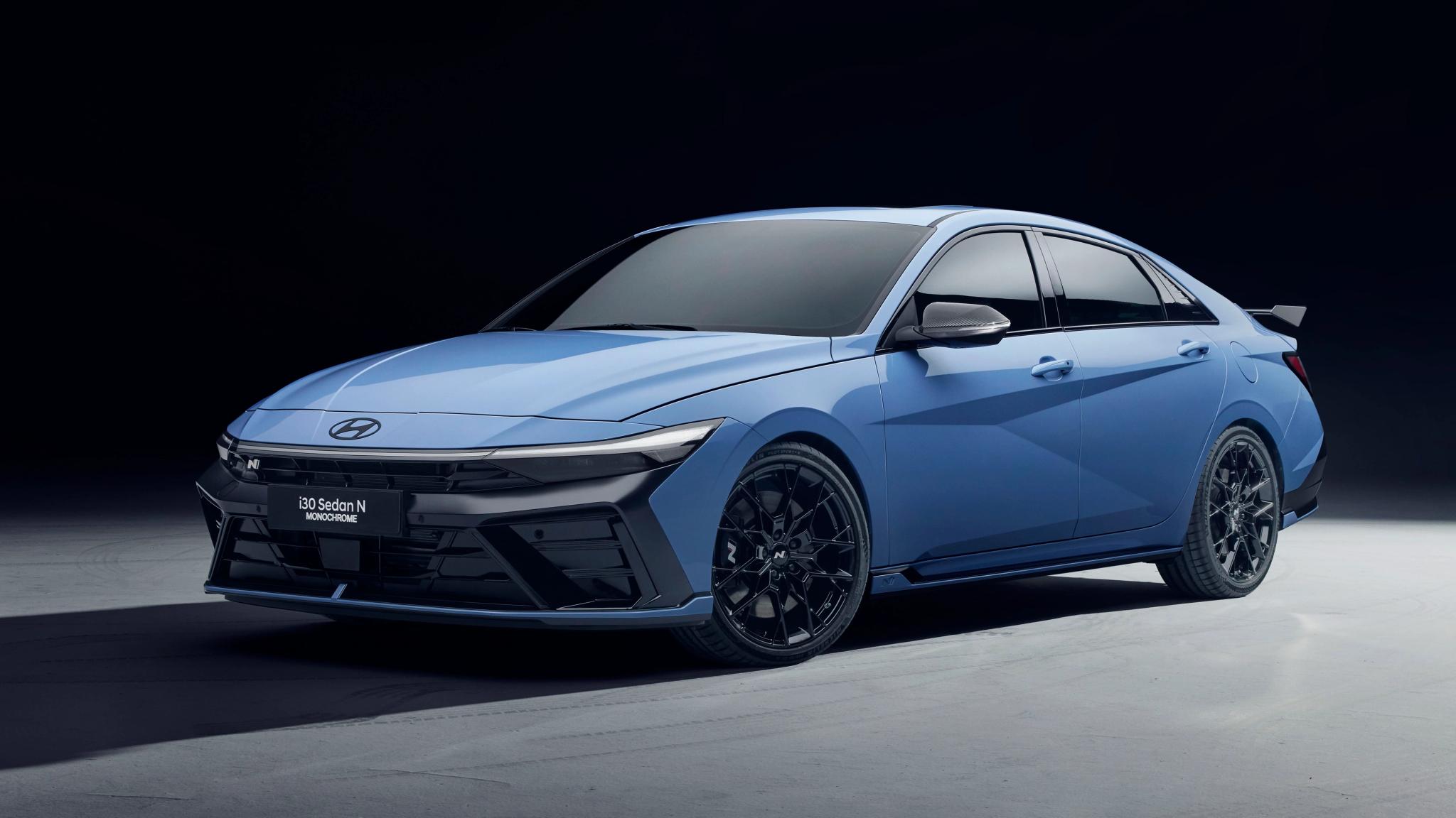 Hyundai i30 Sedan N Monochrome limited edition performance sedan in Abyss Black Pearl with forged wheels and carbon fibre rear spoiler