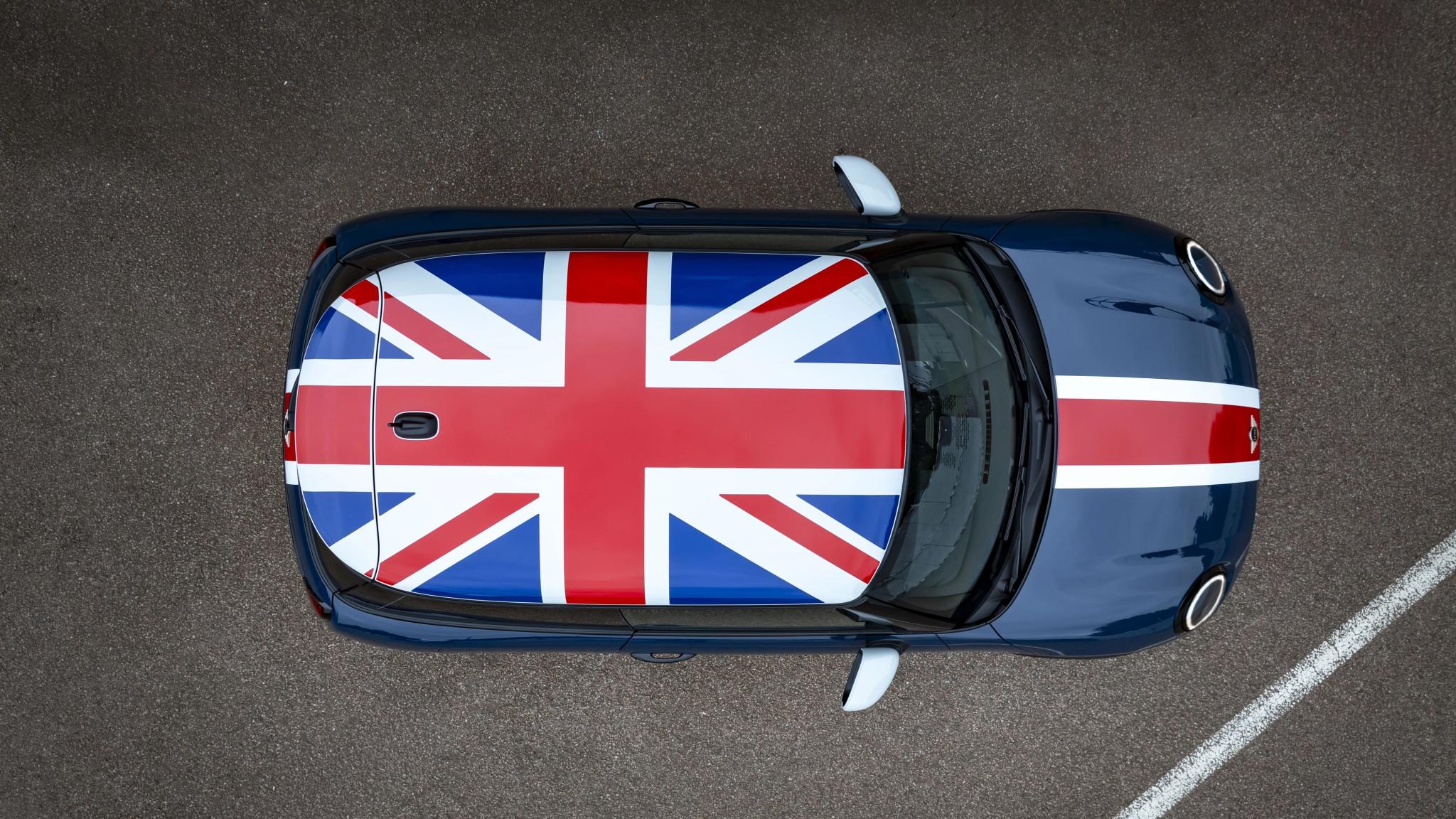  2026 MINI Cooper Oxford Edition showing Union Jack roof graphic and Indigo Sunset Blue paint