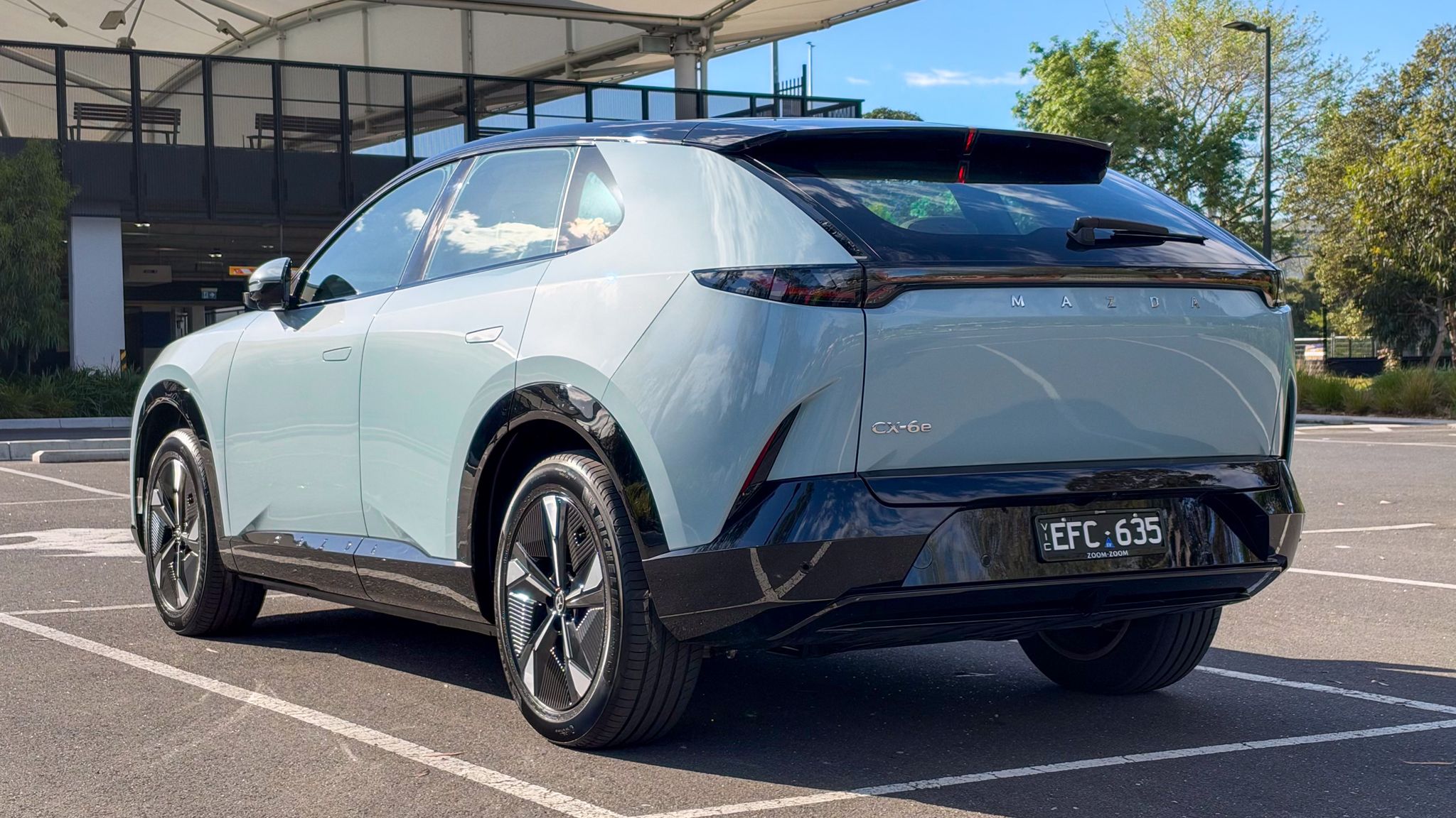 2027 Mazda CX-6e rear three quarter
