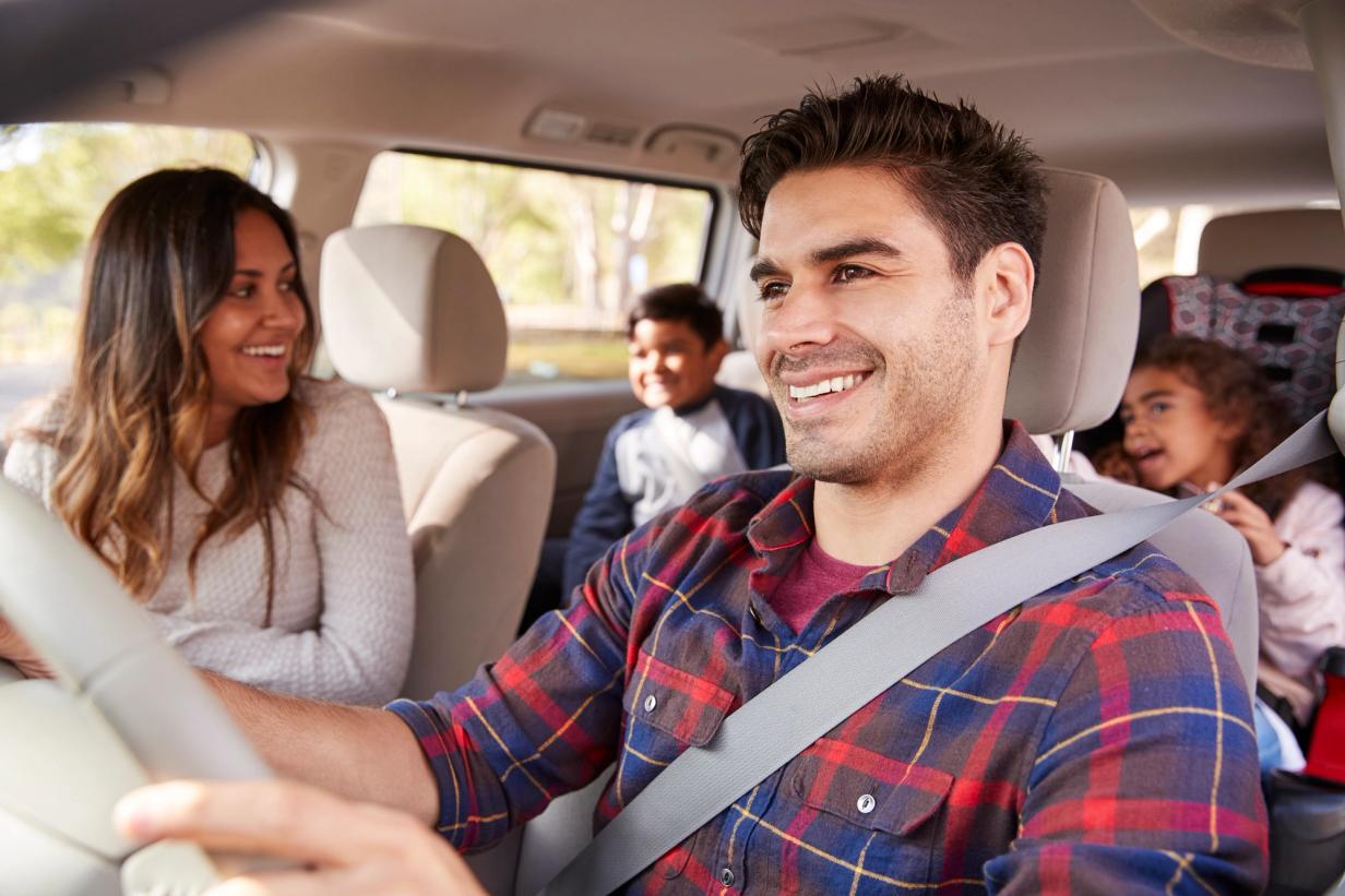 A family inside a car enjoying a safe and affordable vehicle that represents the best used car choices for shoppers in the USA.