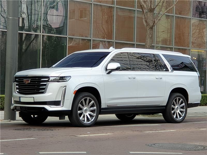 2023 Cadillac Escalade luxury SUV parked outside a building