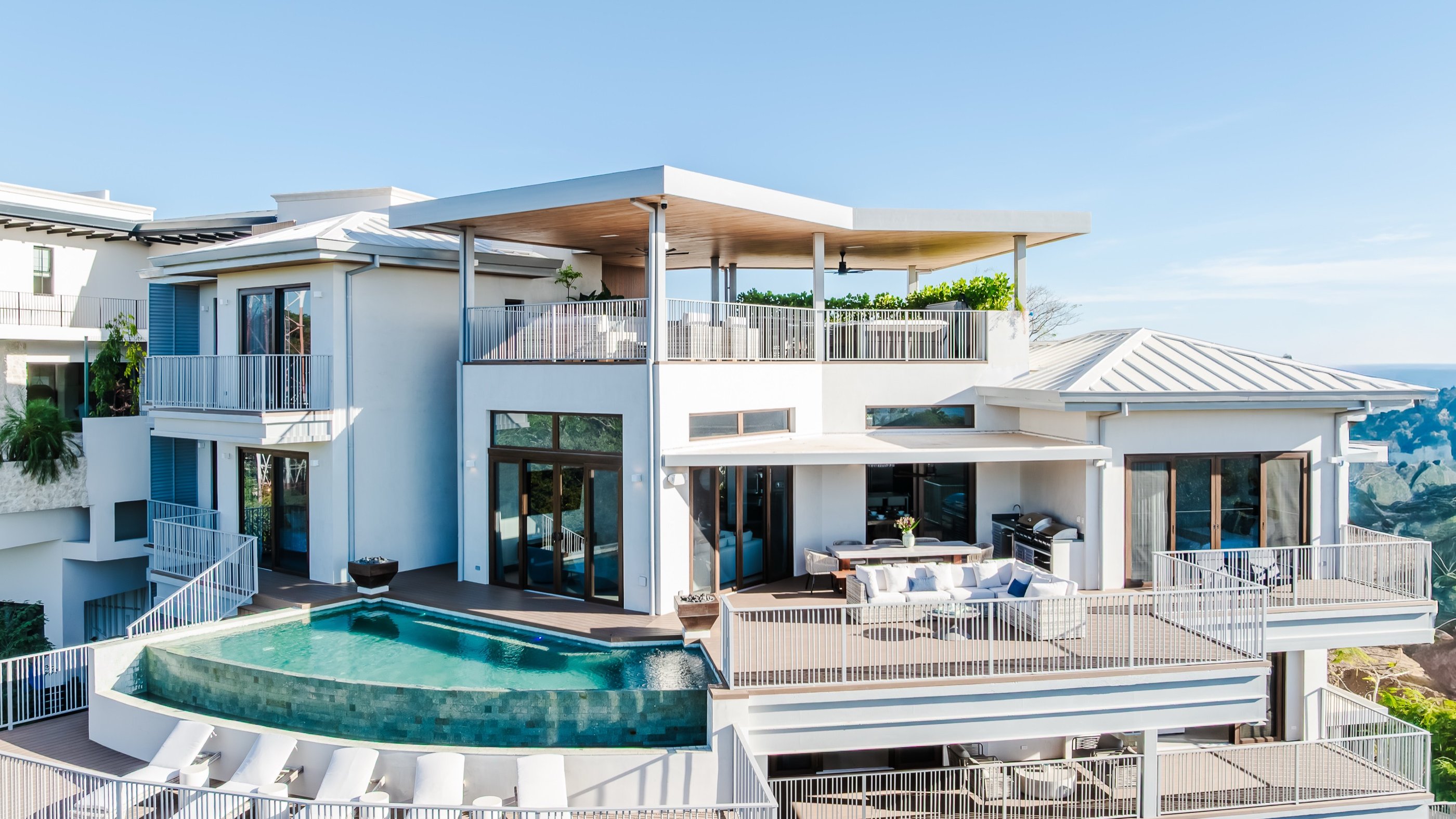 White multi-level residence with infinity pool and ocean-view terraces in Guanacaste
