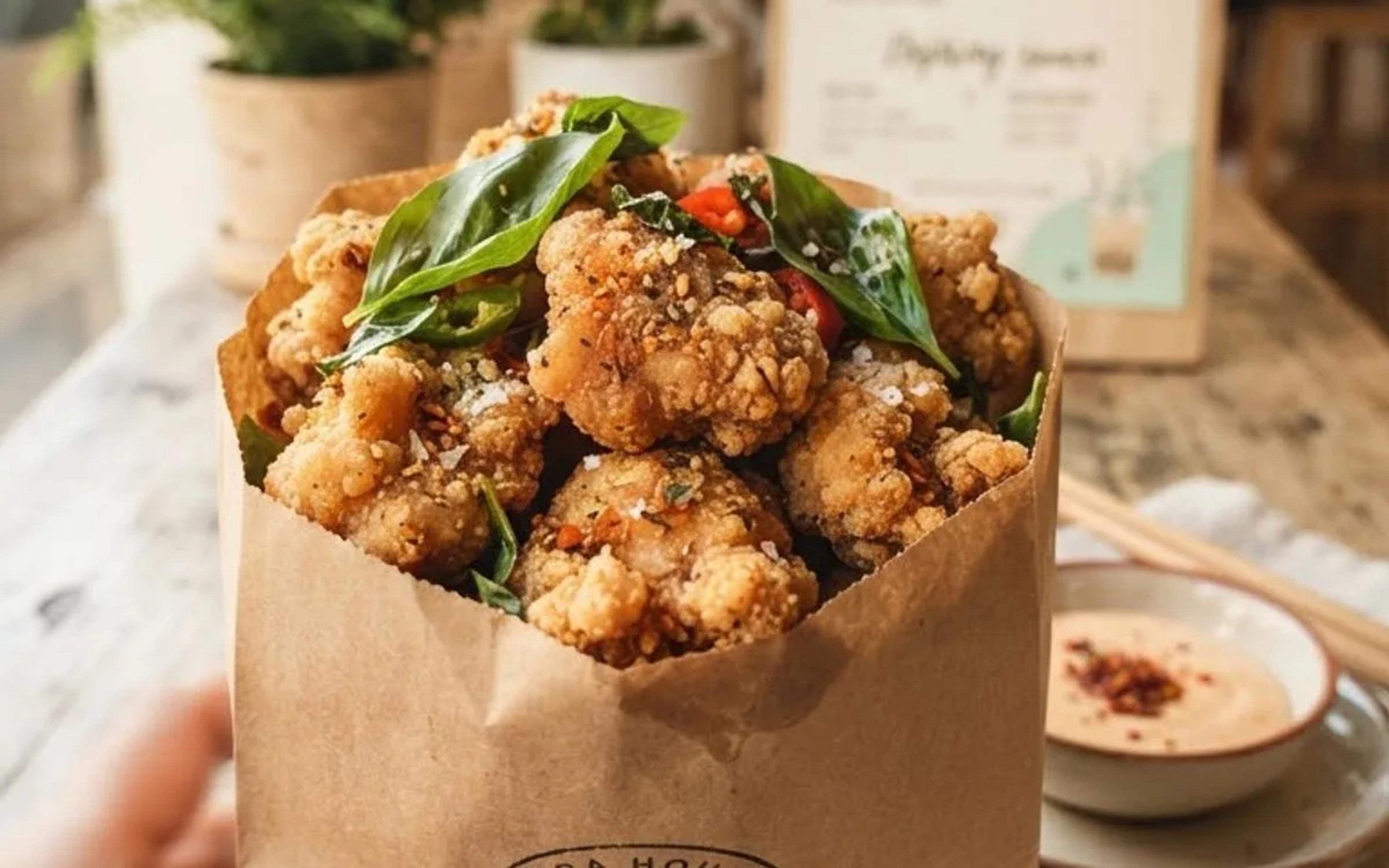 Spicy salt-and-pepper popcorn chicken in a Boba House takeaway bag