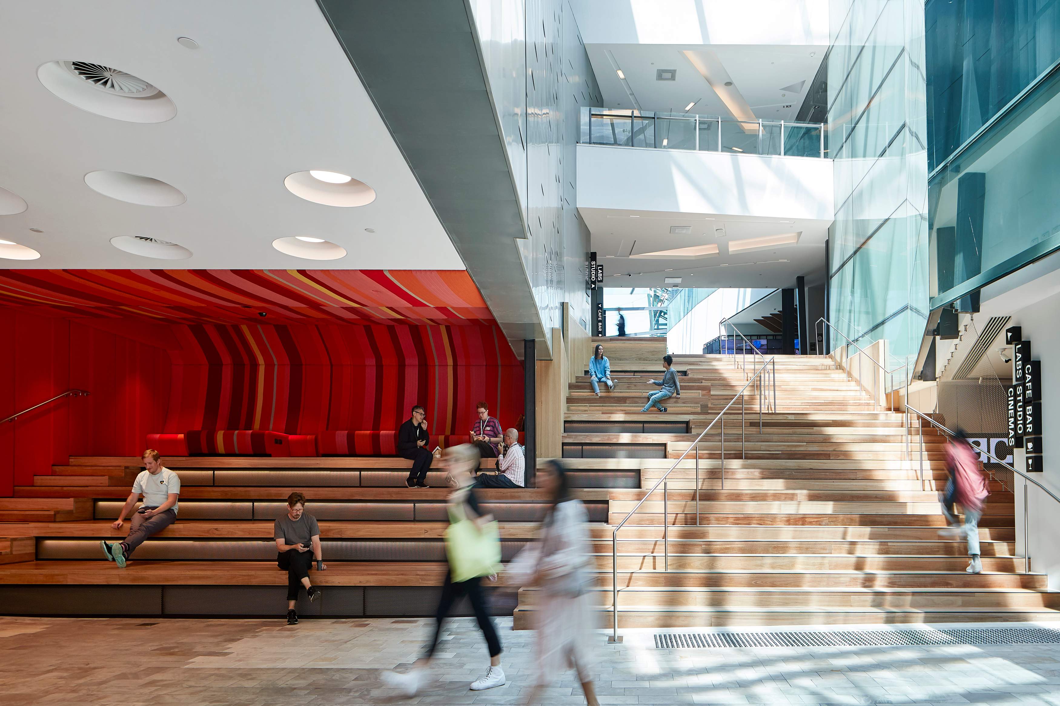 Timber staircase along an atrium