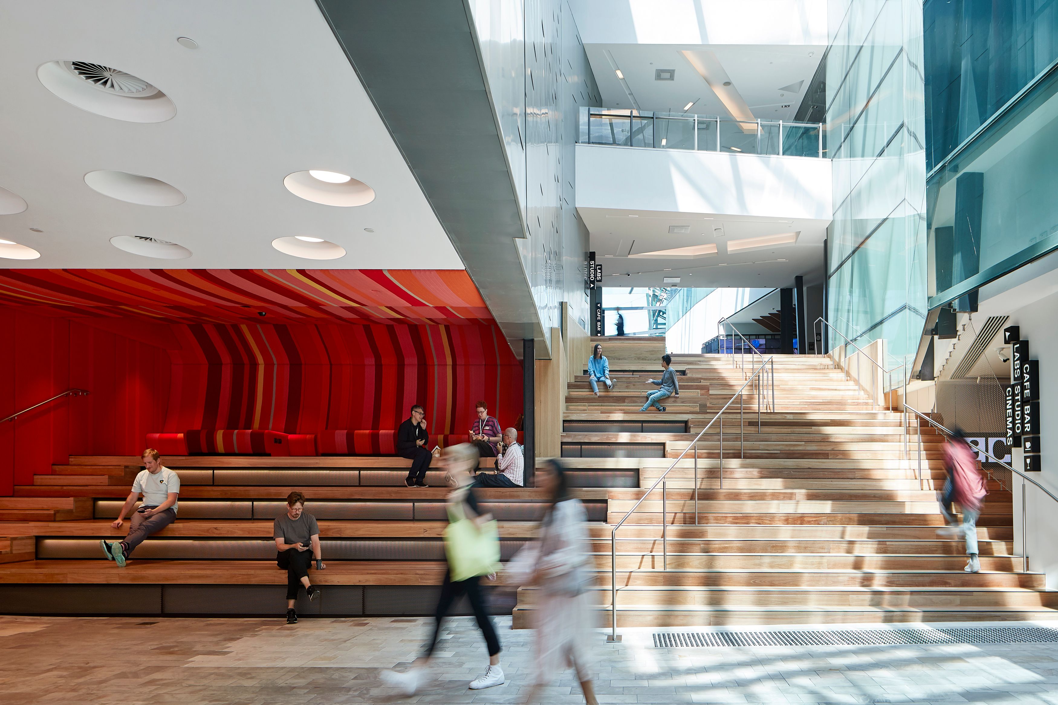 Timber staircase along an atrium