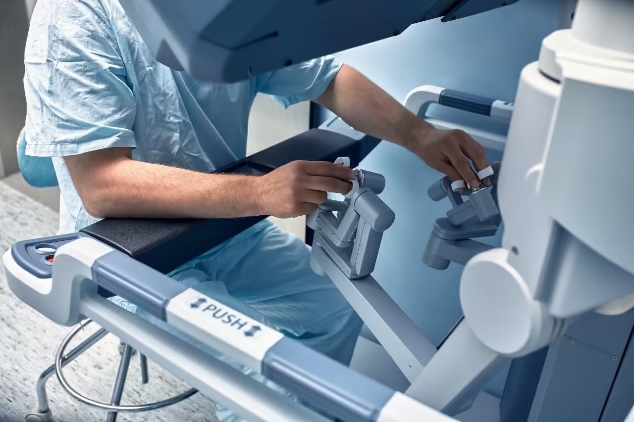 The da Vinci surgical robot’s instrument arms positioned over an operating table in theatre
