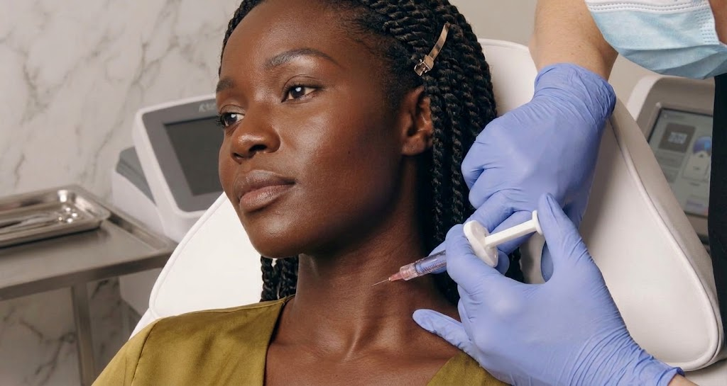 Patient receiving a bio-stimulator neck injection treatment at clinic in Ajax
